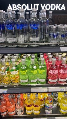 bottles of vodka are on display in a store