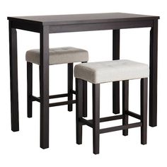 two stools and a table with one chair up to the other in front of it