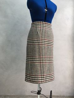 Hand-sewn pencil skirt featuring chunky black double-ended zip.  Made from pure new wool check fabric - deep cream background, black check with burgundy accents. Fully lined.  Perfect for stylish office-wear. Please see the final picture, I have made a small repair to the lining, but this is scarcely visible. Size 8-10. Classic Wool Pencil Skirt For Work, Elegant Plaid Skirt For Work, Fitted Tweed Skirt For Office, Plaid Pleated Skirt For Work, Classic Tweed Skirt For Work, Fitted Plaid Skirt For Office, Office Tweed Pencil Skirt, Elegant Houndstooth Skirt For Office, Plaid Pencil Skirt For Work