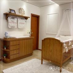 a baby's room with a crib, dresser and changing table in it