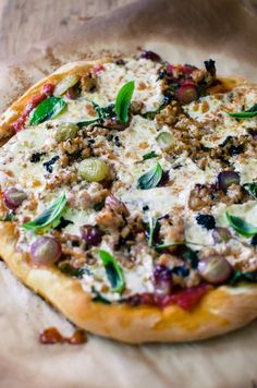 a pizza sitting on top of a wooden table