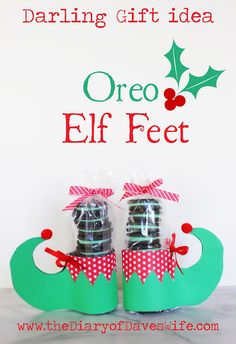 two elf feet are sitting in front of a christmas sign