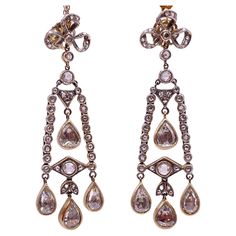 An absolutely superb pair of rose-cut diamonds earrings from 1920s ( Artdeco ) . These incredible earrings are crafted in 14k gold and feature a sparkling array of rose cut Diamond . Approximately 5.00 carats , in which are 8 pieces of 0.50 carat and 1.00 carat set in smaller pieces on this beautiful piece. Vintage Rose Cut Diamond Earrings, Vintage Rose Cut Diamond Earrings For Anniversary, Victorian Diamond White Earrings With Diamond Accents, Antique Rose Cut Diamond Earrings In Diamond White, Vintage Yellow Gold Diamond Earrings With Rose Cut, Antique Rose Cut Diamond White Earrings, Vintage Rose Cut Diamond Earrings For Formal Occasions, Victorian Style Diamond White Rose Cut Diamond Earrings, Vintage Diamond White Single Cut Diamond Earrings