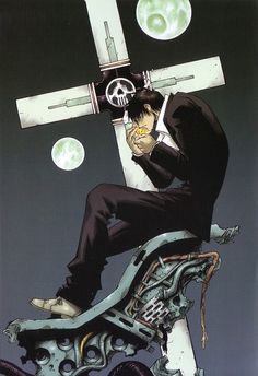 a man sitting on top of a motorcycle under a cross