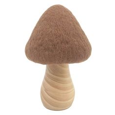 a wooden mushroom sitting on top of a table