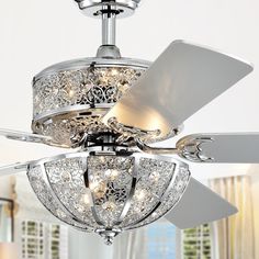 a white ceiling fan with crystal chandelier