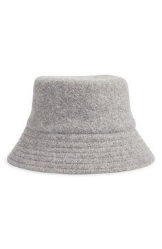 A warm wool blend provide lasting coziness in this classic bucket hat designed to enhance your cold-weather look. 90% wool, 10% nylon Dry clean Imported Casual Adjustable Wool Cloche Hat, Casual Wool Cloche Hat For Winter, Winter Wool Cloche Hat With Flat Brim, Casual Wool Bucket Hat, Trendy Winter Bucket Hat With Flat Brim, Casual Wool Bucket Hat With Curved Brim, Casual Wool Bucket Hat For Winter, Casual Wool Cloche Hat With Short Brim, Casual Wool Brimmed Cloche Hat