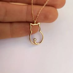 "14K Solid Gold Cat Necklace, Cat Pendant, Dainty Gold Kitten Necklace, Kitty Pendant Necklace, Great Birthday Gift for Cat and Pet Lover,   🧿 Welcome to GDjeweltr special jewelry for yourself and loved ones. All our jewelery is made by handmade in our workshop as custom. Please take a look my store to see our handmade necklaces, rings, earrings and bracelets collection. ⭐ Details: * Material : 14K Solid Gold * Finished Color : Yellow Gold, White Gold, Rose Gold. * Necklace Style    : Minimalis Minimalist Pendant, Cute Pendants, Necklace Cat, Cute Gold Necklace With Cat Design, Cat Pendant, Gold Cat Ring, Gold Charm Necklace With Cat Design For Gift, Gold Cat Design Charm Necklace As Gift, Elegant Cat Design Pendant Necklace