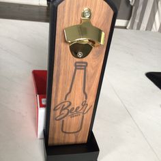 a wooden bottle opener sitting on top of a table