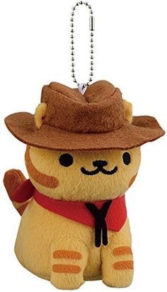 a stuffed animal with a hat and scarf on it's head is hanging from a key chain