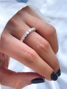 a woman's hand with a ring on it