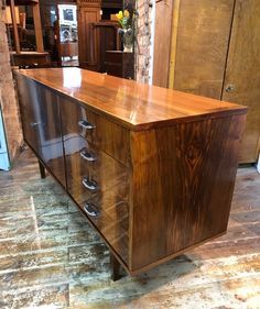 a large wooden dresser sitting on top of a hard wood floor