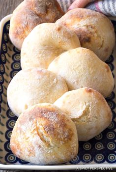 several rolls in a blue and white dish