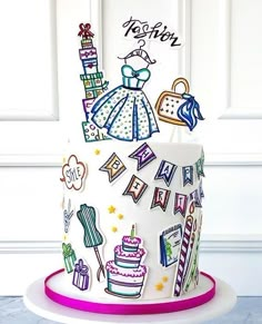 a birthday cake decorated with clothes and accessories