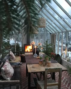 an instagram photo of a living room with a fire in the fireplace