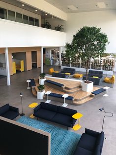 an empty lobby with couches and tables