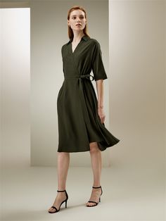 This flowing umbrella hem wrap dress features a V-neck and half-loose sleeves, and is carefully designed to fit all sizes. It has a front tie belt that accentuates the waistline, adding a twist and elegance to this classic casual design. Silk Crêpe de Chine Umbrella Dress, Olive Dress, Loose Sleeves, Silk Knit, Tie Wrap, Classic Casual, Shirt Dresses, Casual Design, Silk Charmeuse