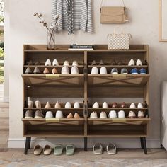 there are many pairs of shoes on the shelf next to each other in this room