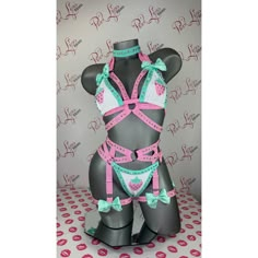 Introducing a scintillating lingerie set, designed to ignite passions and steal hearts. This three-piece ensemble exudes allure with its strappy design, embracing the body in a tantalizing embrace. Each piece is meticulously adorned with radiant crystals, casting shimmering reflections with every movement. Adding a touch of whimsy and femininity, large bows in matching neon-pink accentuate curves and enhance the ensemble's playful charm. Whether for a romantic evening in or a sultry night out, t Rave Fits, Pole Wear, Cute Lingerie, Bra Pattern, Lingerie Set, Dance Outfits, Bra Tops, Neon Pink, Festival Outfits