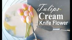 tulips cream knife flower sitting on top of a plate with the words tulips cream