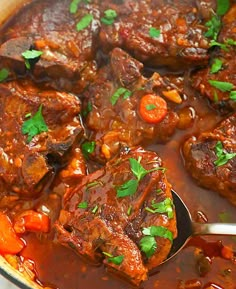 a pot full of stew with meat and carrots