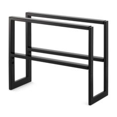 two black metal shelves with one shelf on each side and the other half closed up