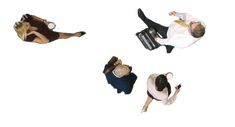 four people laying on the ground with their feet in the air