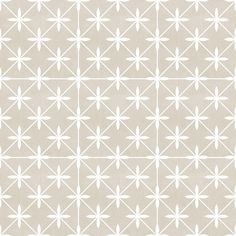 a beige and white wallpaper with small stars