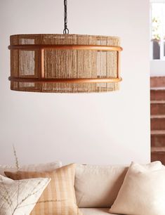 a living room filled with furniture and a chandelier hanging from it's ceiling