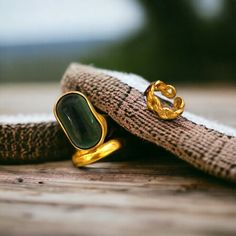 Elevate your style with our exquisite collection of vintage green stone rings. Our gold band and chain rings are perfect for adding a touch of glamour to any outfit. Whether you're looking for a statement piece or a charming gift, our women's jewelry will surely impress. Embrace the essence of streetwear fashion with our stocking ring set. Discover the perfect ring to make a fashionable statement. *Beautiful and charming sterling silver ring with a gold stone (925 stamped) *Adjustable *This ring is stylish and pretty ideal for everyday use. * Gender: Female *Ready to Ship in 1-2 Business Days * The product will be sent to you nicely packages and ready for gift giving. * Visit our store, browse other jewelry, silver, and gold collections, and find the perfect piece you're looking for. ♥️ Lo Vintage Tarnish Resistant Open Ring Jewelry, Vintage Gold Plated Open Ring Jewelry, Vintage Green Crystal Open Ring, Vintage Green Emerald Open Ring, Vintage Emerald Green Open Ring, Vintage Gold Plated Tarnish Resistant Rings, Vintage Gold Plated Rings, Green Gold-plated Ring, Green Gold Plated Ring