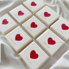 nine small white and red hearts on top of each other