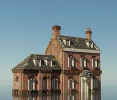 a large brick building with windows and lots of plants on the roof is reflected in water