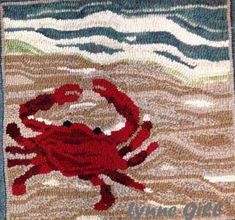 a crab hooked up to the side of a rug