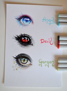 four different colored eyes on top of a piece of paper