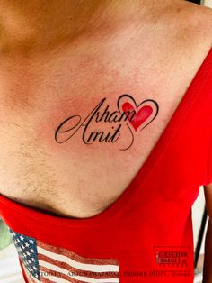 an american flag and heart tattoo on the back of a man's chest,