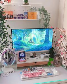 a computer monitor sitting on top of a white desk next to a keyboard and mouse