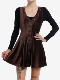 Make room for the cozy cottage dress of your dreams! This brown corduroy dress has a V-neckline and features buttons down the front. Perfect for layering over a cozy long-sleeve! Shirt not included.95% polyester; 5% spandexWash cold; dry lowStretchy materialLength: 33''ImportedListed in junior sizesModel is 5'10''Model wears size Small Bodycon Dress With Cardigan, Brown Corduroy Dress, Cottage Dress, Brown Corduroy, Corduroy Dress, Pinafore Dress, Cozy Cottage, Dress With Cardigan, Tank Dress