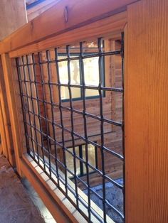 a window with bars on the side of it