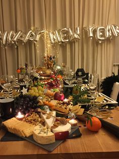 a table topped with lots of different types of cheese and crackers on top of it