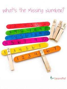 wooden pegs with numbers on them and the words what's the missing number?