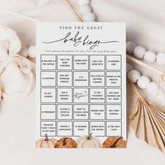 a printable baby shower game with pumpkins and shells on the table next to it