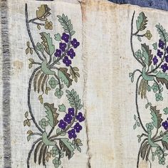 two pieces of cloth with flowers and leaves on them