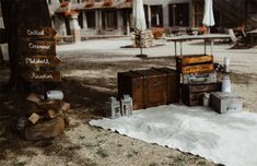 an old fashioned radio sitting on top of a white rug next to a wooden sign