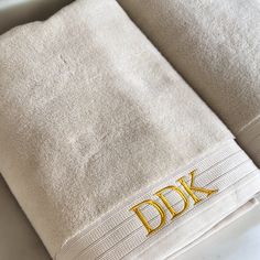 two towels with the word dik embroidered on them