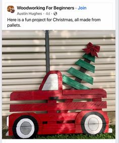 a red truck with a christmas tree on the back