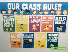 a bulletin board with children's class rules on the front and behind it are pictures of people