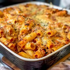 a casserole dish filled with pasta and cheese