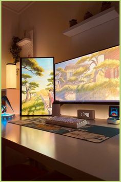 two computer monitors sitting on top of a desk