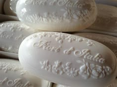 several white soaps are stacked on top of each other