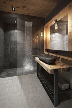 an instagramted photo of a bathroom with dark wood and gray tile on the walls